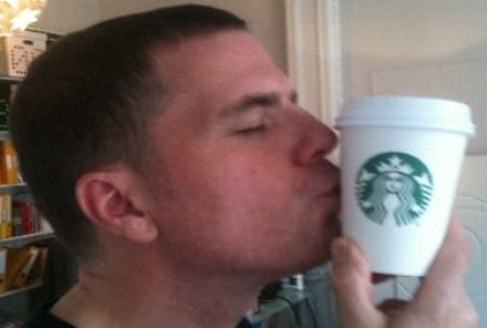 Alex kissing a Starbucks cup