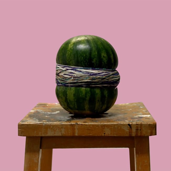 Elastic bands around a watermelon