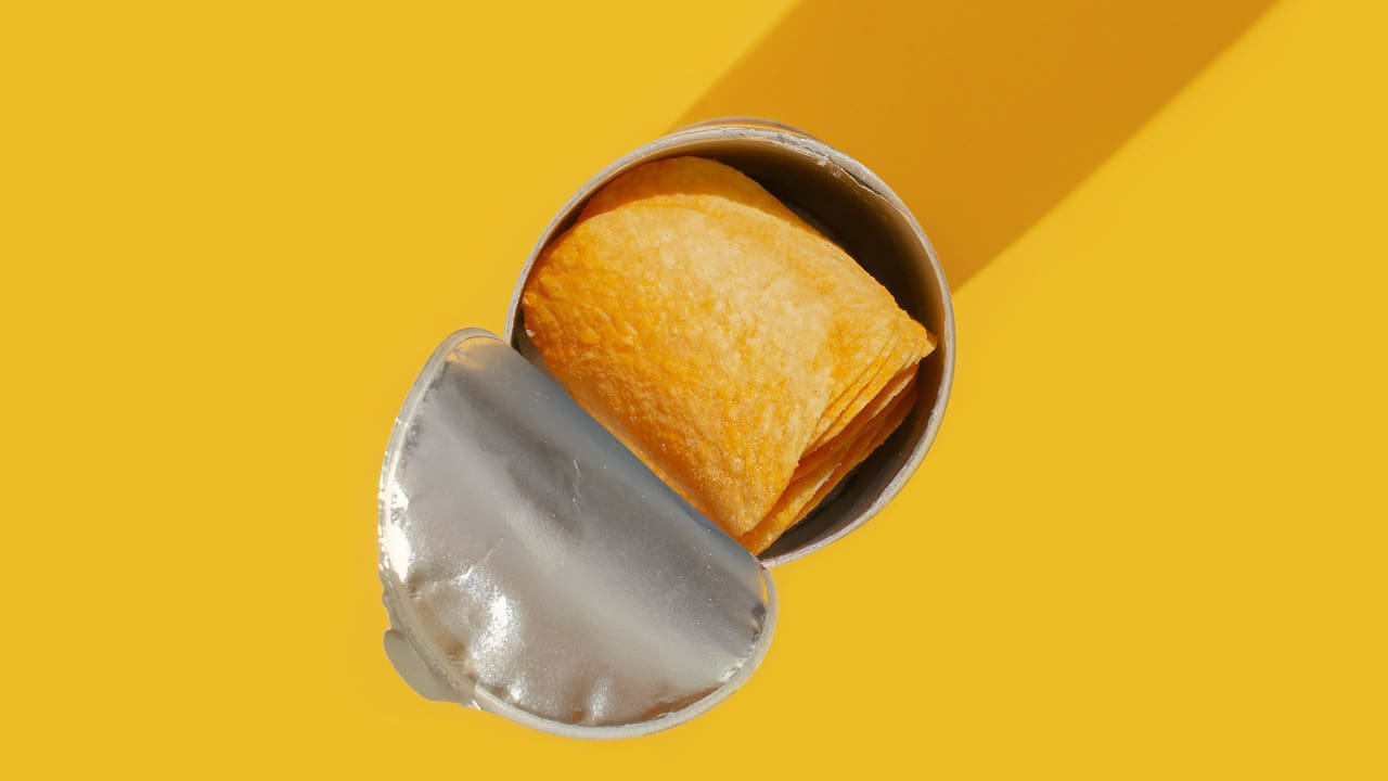 pringles can from above, on a yellow background